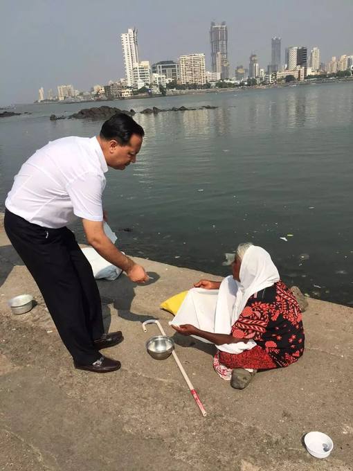 Helping a woman at the water&rsquo;s edge