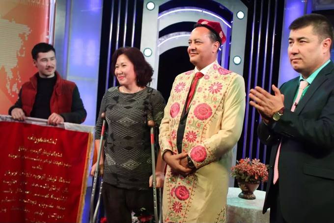 Presented with a plaque of thanks on television