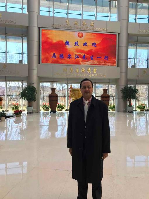 Before a conference hall in Xinjiang
